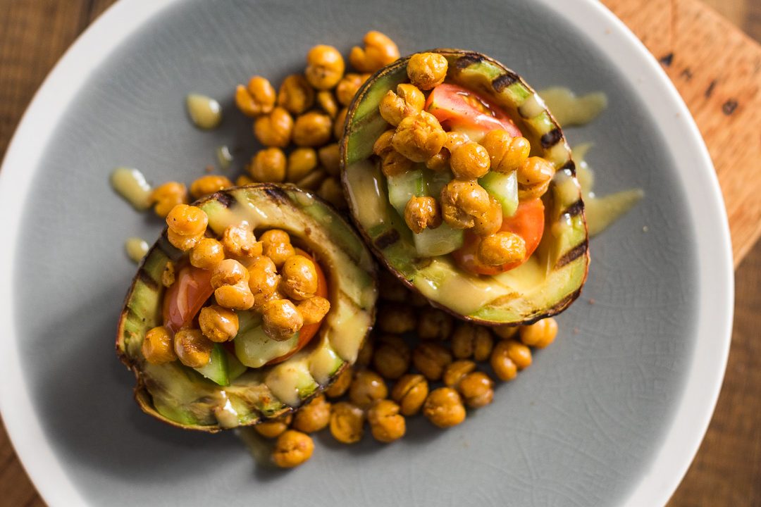 Grilled avocado with roasted chickpeas and tahini sause